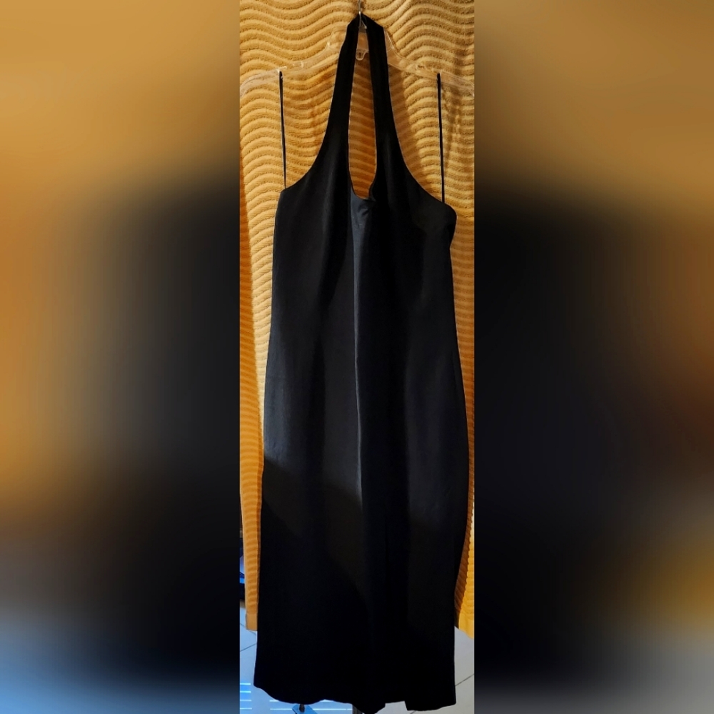 Black linen halter dress with side slit.